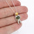 Sterling Silver astronaut pendant necklace with green moldavite glass and gold enamel helmet visor - the perfect space jewelry gift!