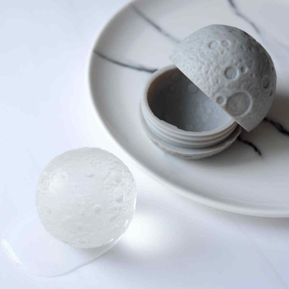 http://www.interstellarseller.com/cdn/shop/products/Moon-Ice-Ball-Mold-Round-Sphere-Whiskey-Ice-Ball-Maker-Space-Gift-Daydreamer-4_1200x1200.jpg?v=1606764413