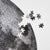 moon puzzle from Four Point Puzzles with 1000 pc round design. A space gift for space enthusiasts! Close-up of puzzle pieces.