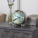 Spacey table clock by Pendulux modeled after space age automobile dashboard clock! Green face with round convex front.