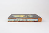 A book of cool photos of space from NASA, shown from the side.