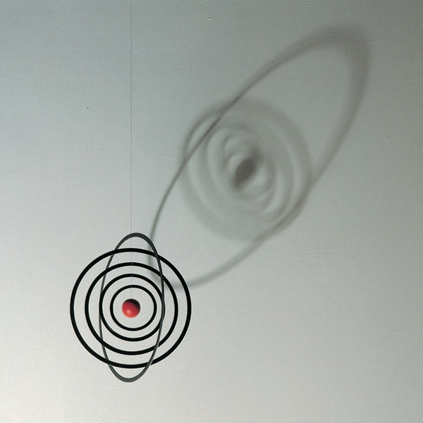 space orbit mobile casting shadow on wall