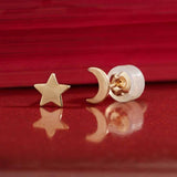 A mismatched pair of 14k solid yellow gold crescent moon and star stud earrings - the perfect space jewelry gift for a space or moon lover!