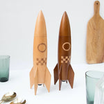 A large wooden rocket ship shaped salt/pepper grinder! A fun space gift for an adult space enthusiast.