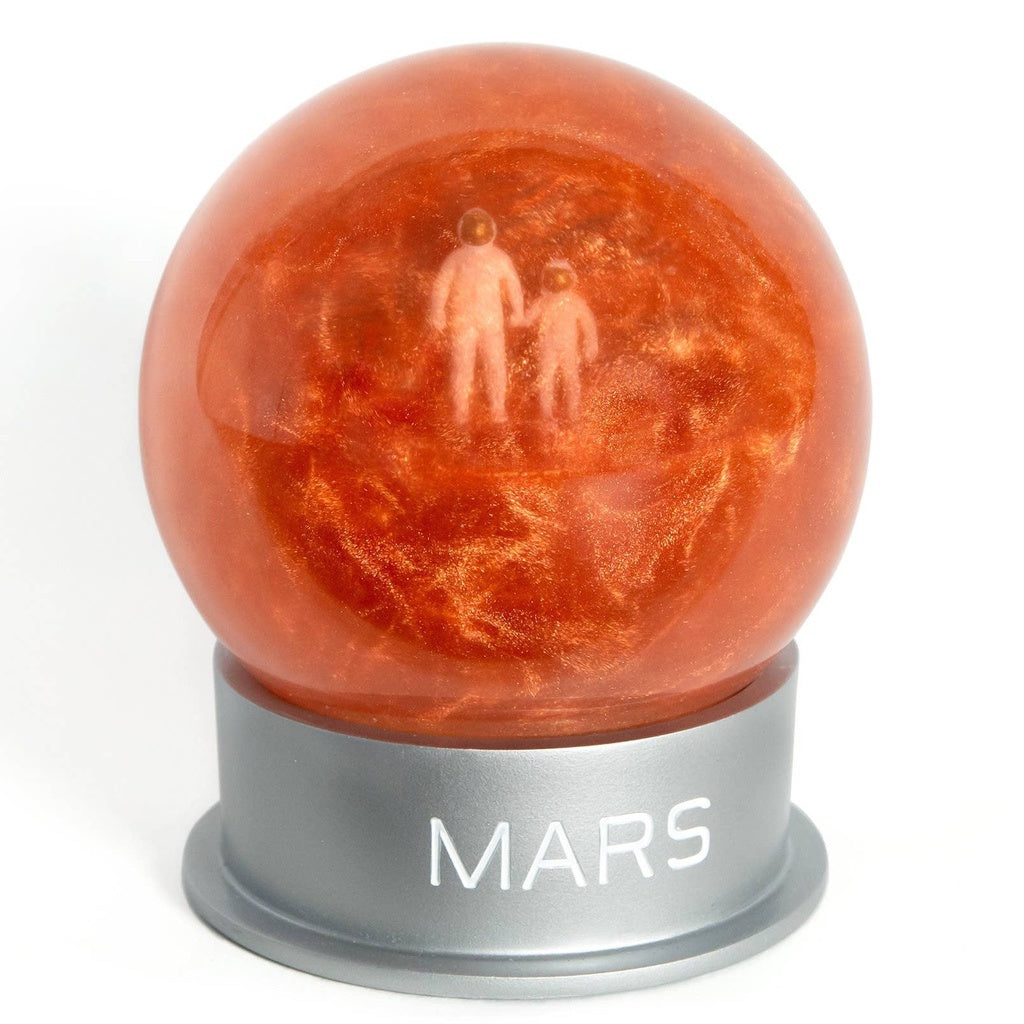 Glass Mars dust snow globe with adult and child astronaut - planet Mars space-themed gift - showing swirling Mars dust