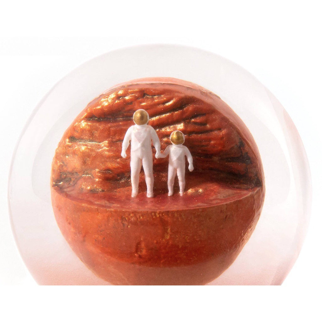 Glass Mars dust snow globe with adult and child astronaut - planet Mars space-themed gift - close up