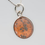 A sterling silver pendant space necklace with genuine Martian Mars meteorite dust inside! Space jewelry at its finest.