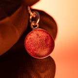 A sterling silver pendant space necklace with genuine Martian Mars meteorite dust inside! Space jewelry at its finest.