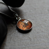 A sterling silver pendant space necklace with genuine Martian Mars meteorite dust inside! Space jewelry at its finest.