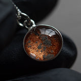 A sterling silver pendant space necklace with genuine Martian Mars meteorite dust inside! Space jewelry at its finest.