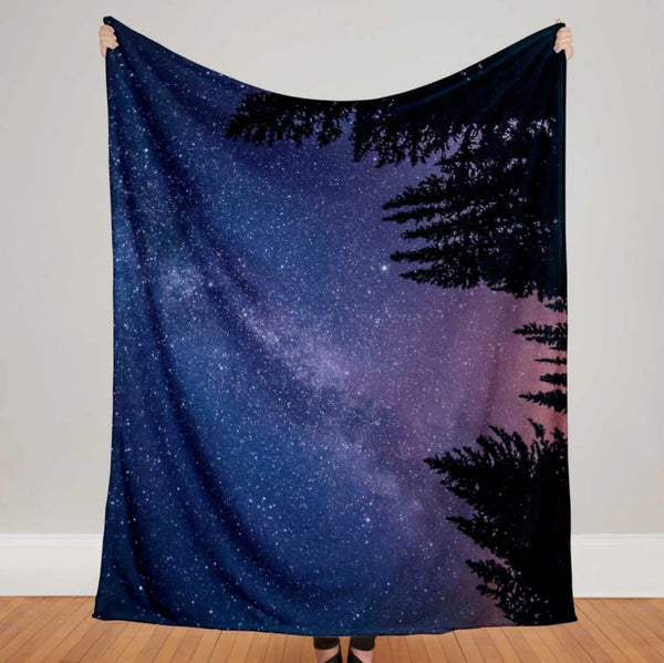 Starry night sky photo throw blanket showing the Milky Way galaxy above the trees - a beautiful space throw blanket gift!