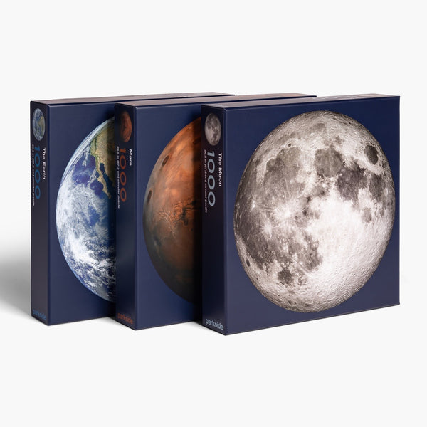 Space gift for adults - the best space planet puzzle set from Parkside Puzzles, formerly Four Point Puzzles! Part of the Planetary Puzzle Set. Showing the front of the box of the Moon, Earth and Mars puzzles.