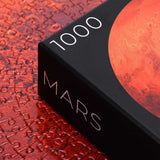 Round 1000 piece Mars puzzle - planet puzzle space gift - corner of box with puzzle in background