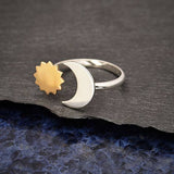 A sterling silver adjustable ring with a crescent moon and bronze sun - a unique space jewelry gift for space and astronomy lovers!