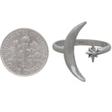 A sterling silver adjustable ring with a crescent moon and star - an elegant space jewelry gift, shown next to dime for size comparison