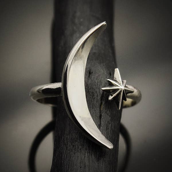 A sterling silver adjustable ring with a crescent moon and star - an elegant space jewelry gift