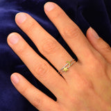 A sterling silver ring set with a bronze moon and star - the perfect dainty space rings jewelry gift, shown on a hand.