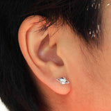 Small sterling silver planet Saturn planet earrings - a cute space jewelry gift! Shown on ear.