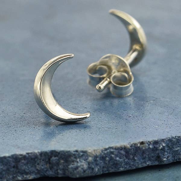 A pair of small sterling silver crescent moon stud earrings - the perfect space or moon jewelry gift for a space or moon lover!