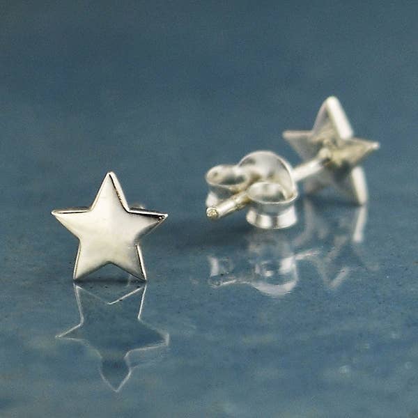 A pair of tiny sterling silver star stud earrings - the perfect space jewelry gift for a space lover!