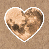 A vinyl heart moon sticker, perfect for any lover of the moon or space!