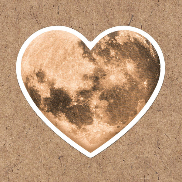 A vinyl heart moon sticker, perfect for any lover of the moon or space!