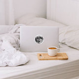A vinyl round full moon sticker shown on a laptop, perfect for any lover of the moon or space!