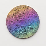 A double-sided rainbow full moon coin made from anodized niobium - a colorful and unique moon gift! Showing far side of the Moon.