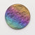A double-sided rainbow full moon coin made from anodized niobium - a colorful and unique moon gift! Showing near side of the Moon.