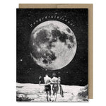 Space themed congratulations wedding or anniversary card showing man and woman walking under a giant full moon. Vintage style.