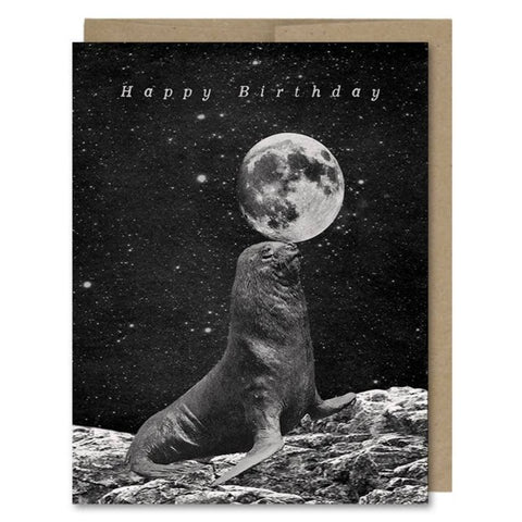 Space-themed Happy Birthday card showing a seal balancing a full moon ball in space! Vintage style.