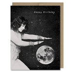 Space-themed Happy Birthday card showing a fortune teller waving her hands of a moon crystal ball in space! Vintage style.