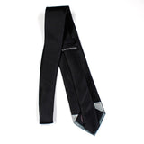 Back view of black space tie showing Earthrise view of earth and lunar surface from space, taken by NASA Apollo astronauts.