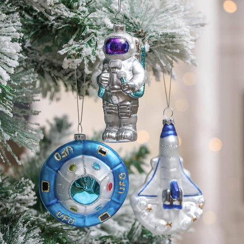 Astronaut Christmas ornament set with UFO and Space Shuttle Rocket in tree