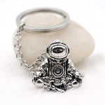 Astronaut key chain of a spaceman meditating. The perfect space gift!