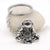 Astronaut key chain of a spaceman meditating. The perfect space gift!
