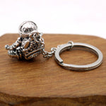 Astronaut key chain of a spaceman meditating. The perfect space gift!