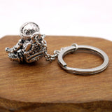 Astronaut key chain of a spaceman meditating. The perfect space gift!