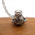 Astronaut key chain of a spaceman meditating. The perfect space gift!