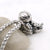 Astronaut necklace showing a spaceman meditating. The perfect space gift!
