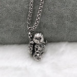 Astronaut pendant showing a spaceman meditating. The perfect space gift!
