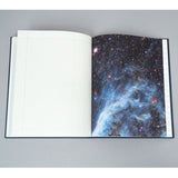 Inside lined notebook page of Princeton Architectural Press Observer's Notebook: Astronomy, with photo of stars and galaxies