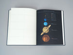 Inside lined space notebook page of Princeton Architectural Press Observer's Notebook: Astronomy, with diagram showing the sizes of the planets of our solar system.