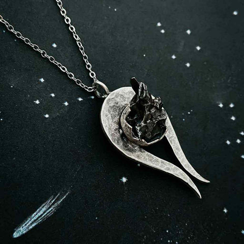Genuine Meteorite necklace in the shape of a comet or shooting star