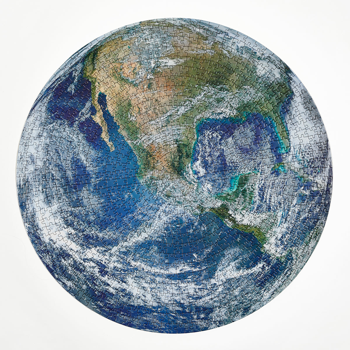 A round earth puzzle by Four Point Puzzles - the perfect space gift! Shows completed puzzle.