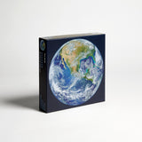 A round earth puzzle by Four Point Puzzles - the perfect space gift! Front of box.