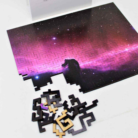 Space theme wooden jigsaw puzzle of the Horsehead Nebula Galaxy with unique geometric pieces.