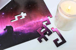A space themed puzzle with geometric wood pieces showing the Horsehead Nebula galaxy. A great gift!