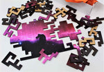 A space themed puzzle with geometric wood pieces showing the Horsehead Nebula galaxy. A great gift!