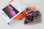 A space themed puzzle with geometric wood pieces showing the Horsehead Nebula galaxy. A great gift!